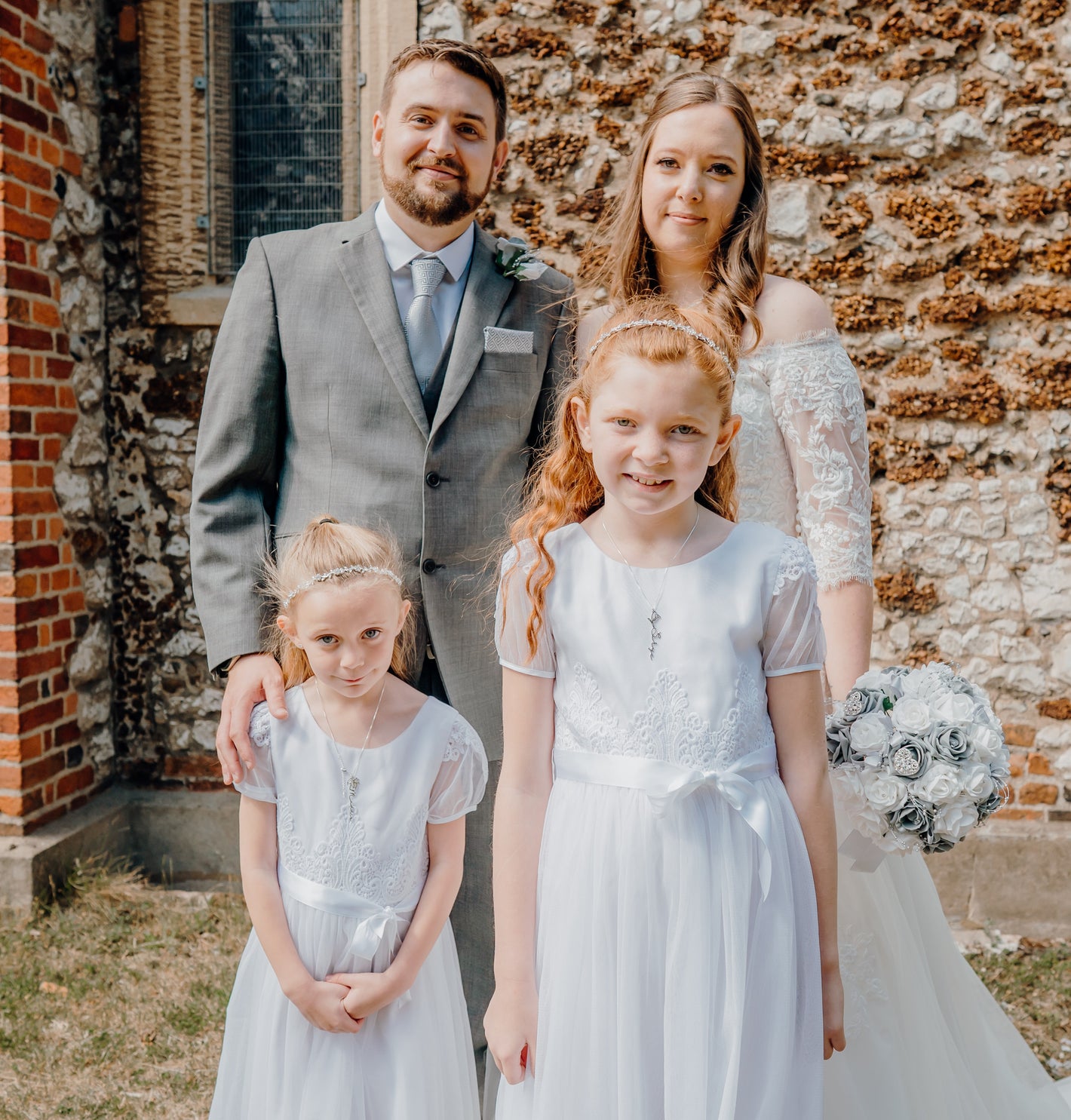 Photo of myself, my husband and our two daughters on our wedding day